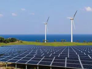 Panneaux solaires et éoliennes, représentant des sources d'énergie renouvelables.