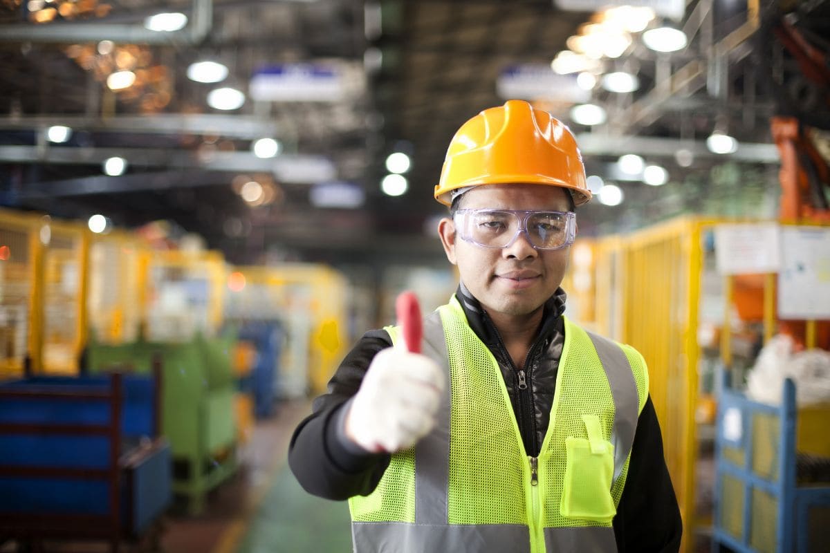 Warehouse worker managing logistics during holiday season to ensure supply chain safety.